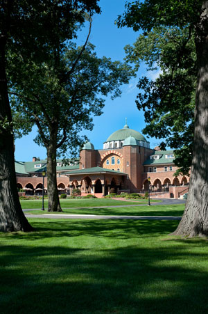 The Medinah Country Club clubhouse from between the trees
