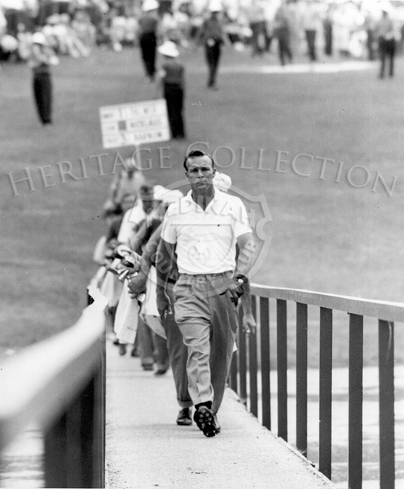 Arnold Palmer is seen crossing one of the bridges that span Lake Kadijah during the 59th Western Open.
