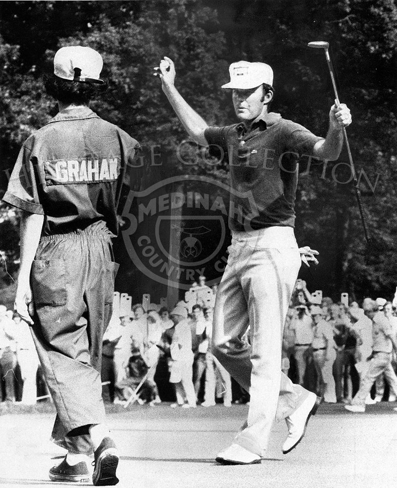Lou Graham lifts his arms to acknowledge cheers after he defeats John Mahaffey in U.S. Open golf playoff Monday at Medinah Country Club. Graham scored an even-par 71, winning by two-strokes.
