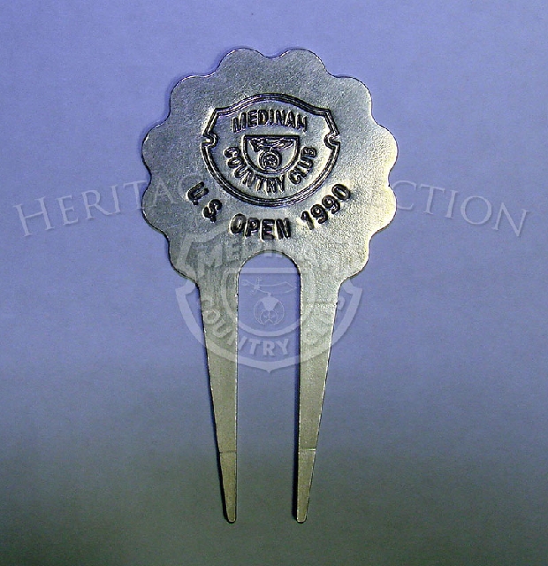 The 90th U.S. Open Championship metal commemortive divot tool featured the official Medinah Country Club logo.