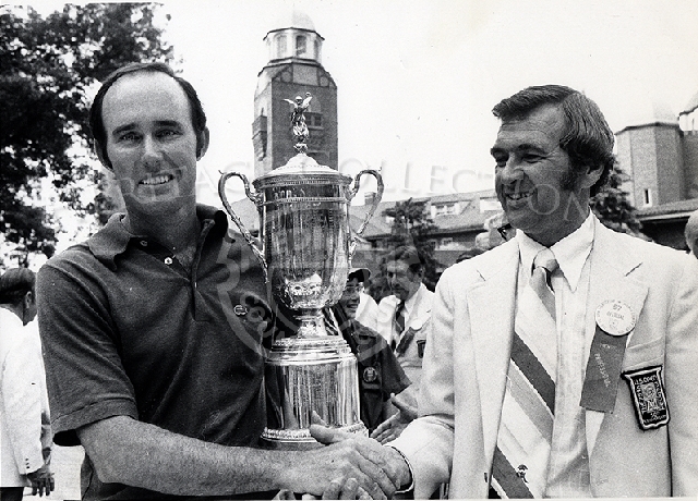 75th U.S. Open winner Lou Graham accepting trophy from John Marschall.