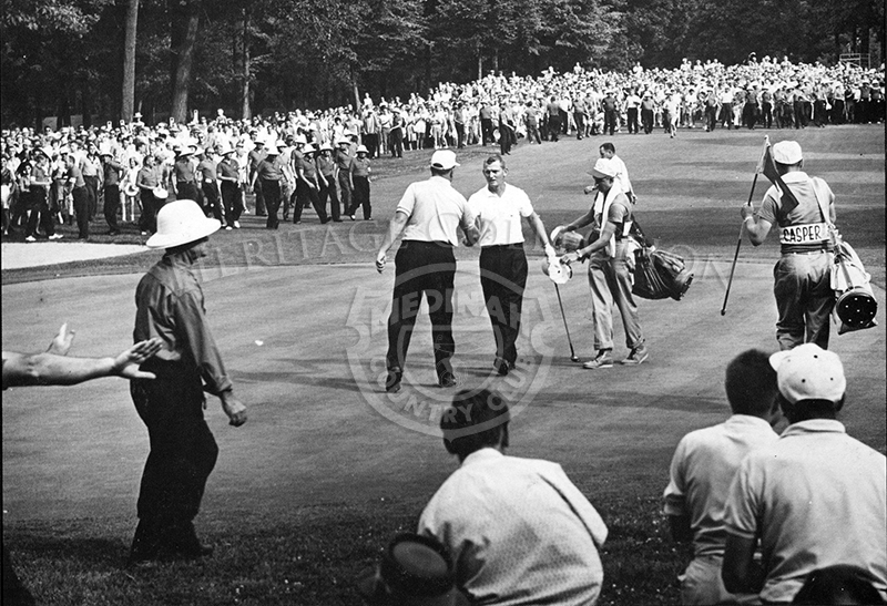 Winner Jacky Cupit, facing camera, shook the hand of runner-up Billy Casper at the conclusion of the 59th Western Open in 1962. The photo appeared in Medinah Country Club's 1983 Event Calendar.