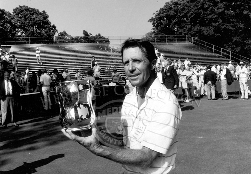 South African professional golfer, Gary Player, holds up the Francis D. Ouimet Trophy, after winning the Ninth U.S. Senior Open Championship. Player, who defeated Bob Charles in the 18-hole playoff on August 9th, was quoted saying, 