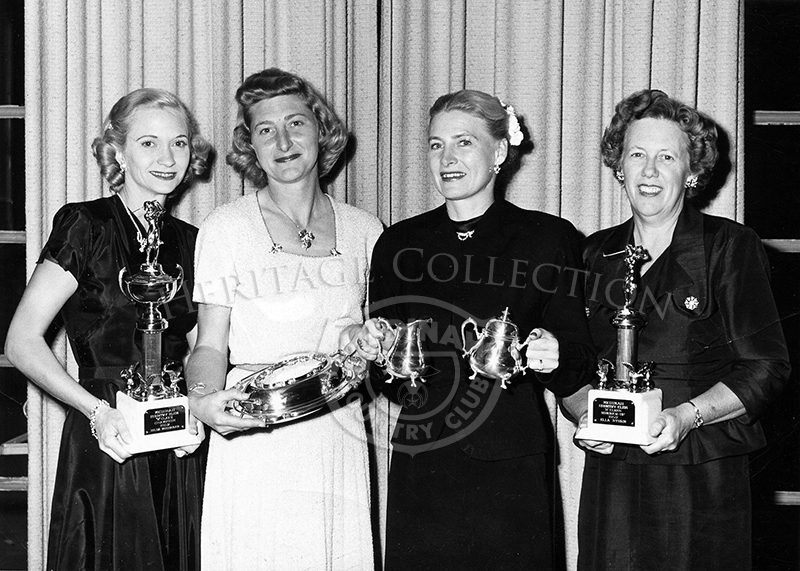 Four ladies standing with trophies. Left to right: Hilda Buchanan, runner-up Betty Sawyer, champion Adeline Potter and Storm Ekla.