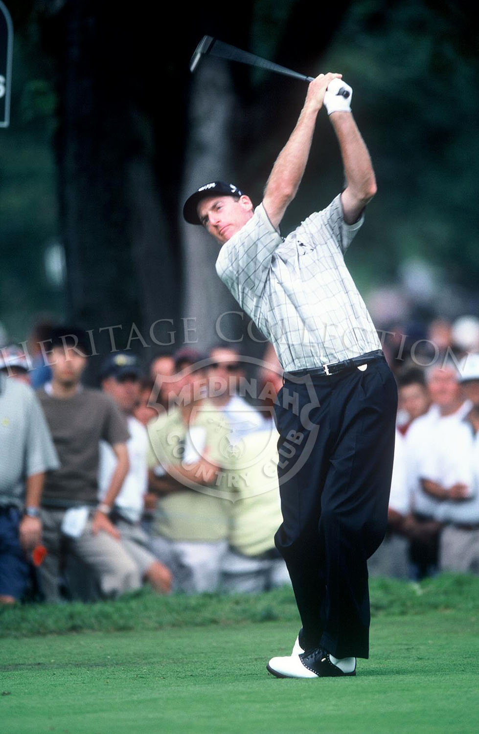 On his way to tie for 8th place with Steve Pate, Jim Furyk uses one of his irons to send the ball closer to a green on Course No. 3. He finished the 81st PGA with a 284.