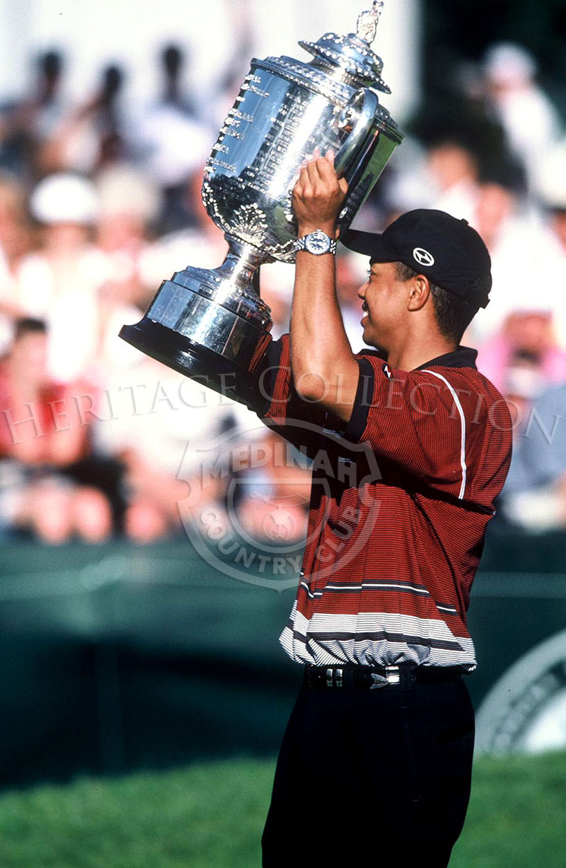 Tiger Woods and trophy.