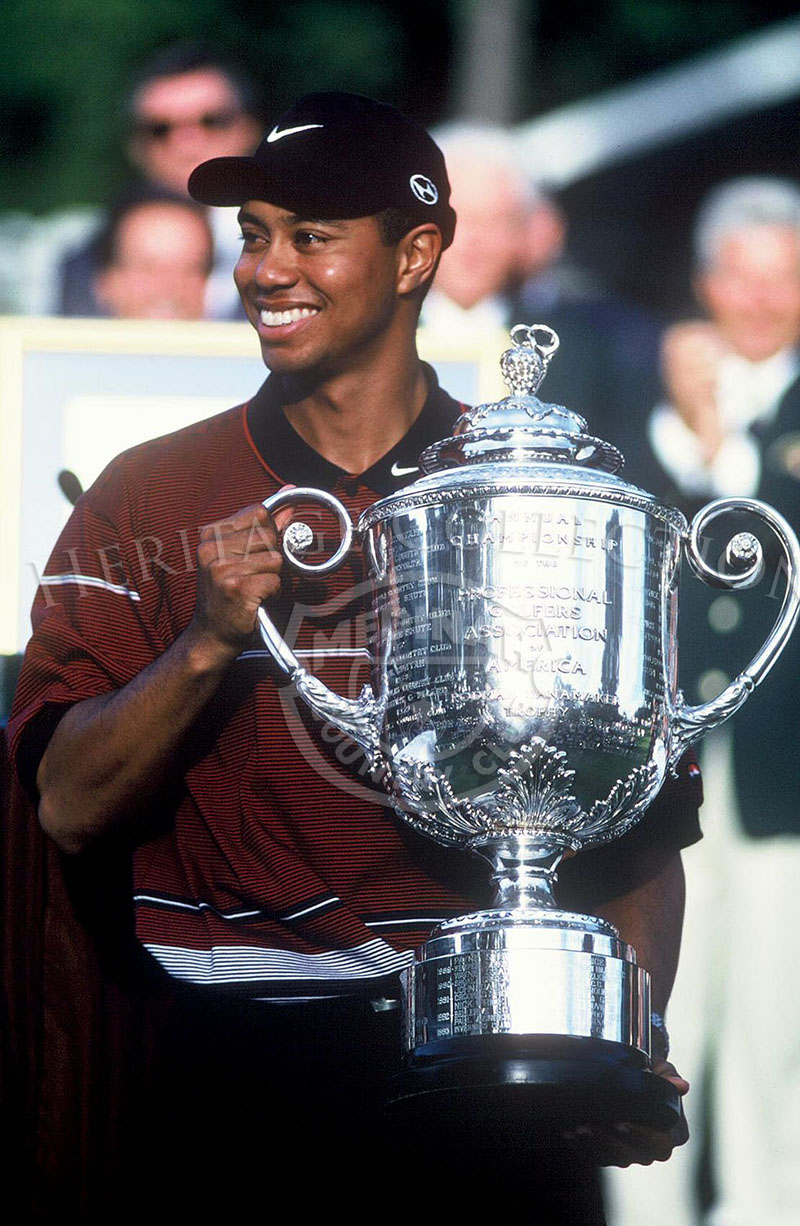 Tiger Woods and trophy.