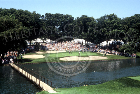 An aerial view captures Medinah Country Club's 13th green of Course No.3, during play at the 90th U.S. Open Championship. The footbridge is one of four that crosses Lake Kadijah.
