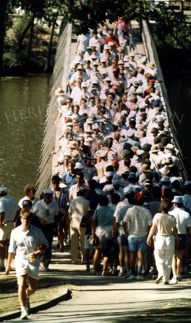 Nearly 134,000 people flocked to Medinah to witness the greatest names in Senior Golf during the Ninth U.S. Senior Open Championship. This scene captures a multitude of fans crossing over one of the four bridges that span Lake Kadijah.
