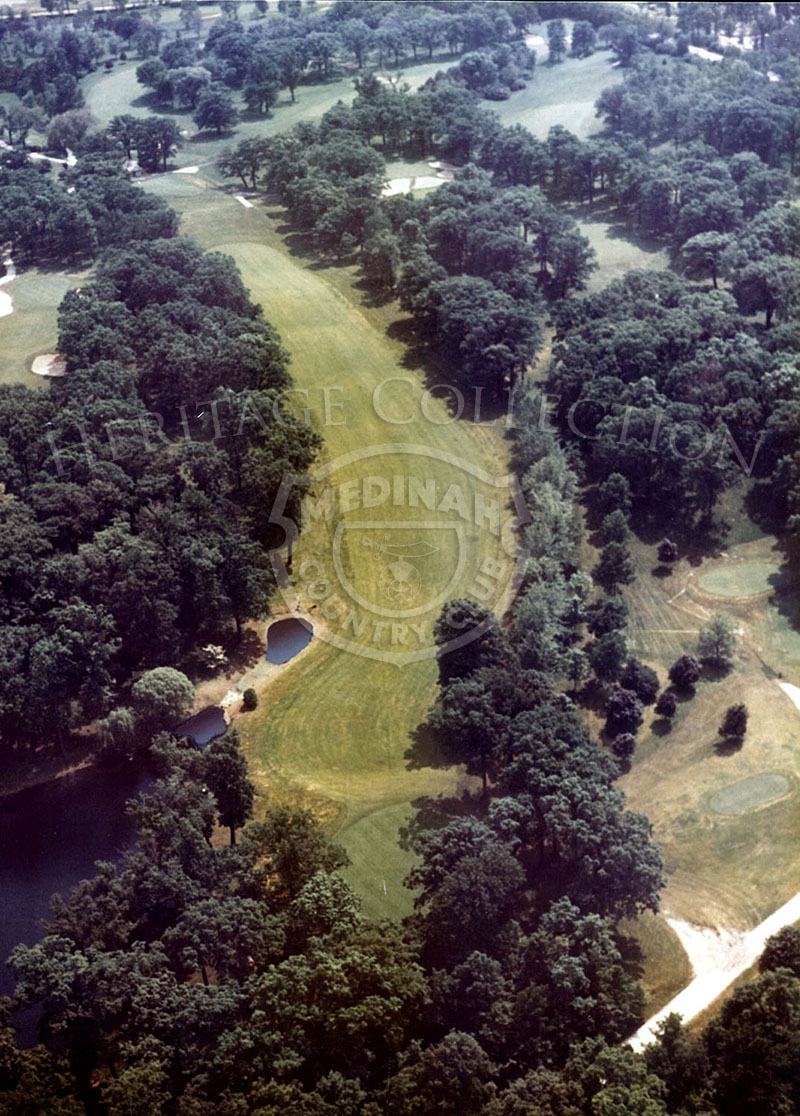 1975 Aerial view of Hole 16 of Course No. 3. The 452-yard par-4 sixteenth has no bunkers, but abounds in trouble from the fairway which kicks towards the right rough to the elevated green where a pushed second shot can end up in the lake.