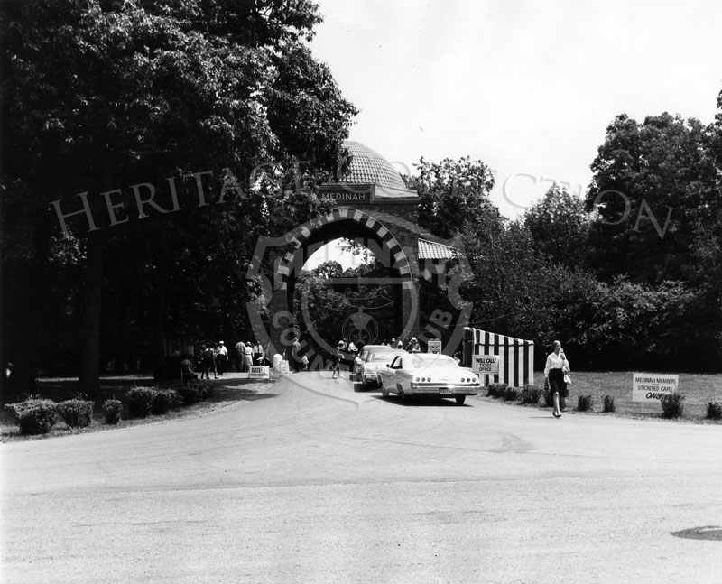 During the 63rd Western Open, Medinah Country Club's main entrance gate was the entrance for Medinah members and properly stickered vehicles only. On the right in the striped tent is the Will Call Ticket office, and the last car in line is a 1965 Chevrolet Impala.