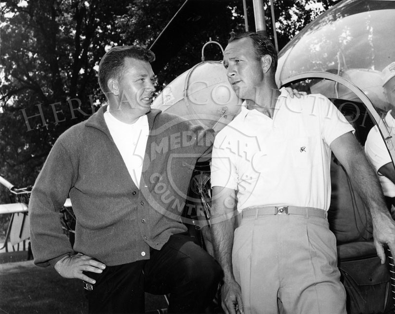 Medinah Country Club's golf pro Jack Bell (left) is seen with Arnold Palmer during the 59th Western Open in 1962. Palmer was transported to and from the tournament in a helicopter piloted by Medinah Country Club member George Snyder.