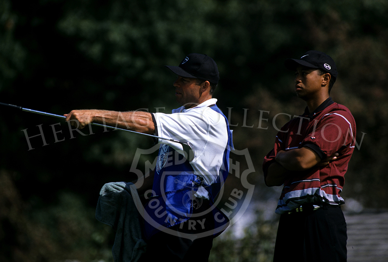 Round 4: Tiger Woods and caddie . Photographer: Montana Pritchard