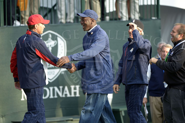 Michael Jordan arrives to greet Captain Love and the US Team Friday morning.