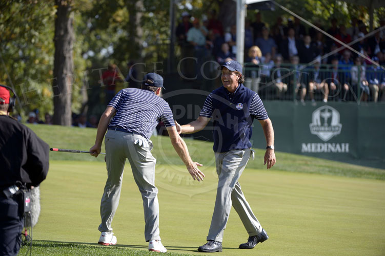 Mickelson and Bradley celebrate after they closeout their match 7up.